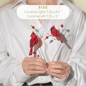 cozy plant decor with red glass birds