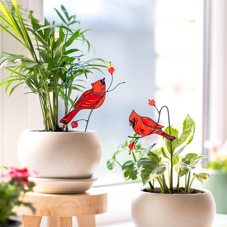 red bird stained glass in cozy home decor