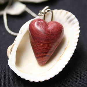 Polymer Clay heart pendant with recycled foil core- red gold swirl
