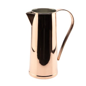 May include: A tall, cylindrical pitcher with a polished copper finish and a reflective surface. The vessel features a wide, open top with a distinct triangular pouring spout and a curved, slender handle attached to the side for easy gripping.