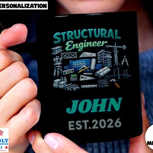 May include: A black ceramic mug featuring the text Structural Engineer in teal, followed by a graphic illustration of engineering tools, blueprints, and construction equipment. The name JOHN is printed in teal below, with the text EST. 2026 in grey.