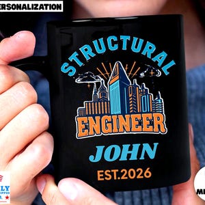 May include: Black ceramic mug with the words "STRUCTURAL ENGINEER JOHN EST.2026" in blue and orange. The mug features a skyline graphic and the text "FREE PERSONALIZATION". The mug is proudly printed and shipped in the U.S.A.