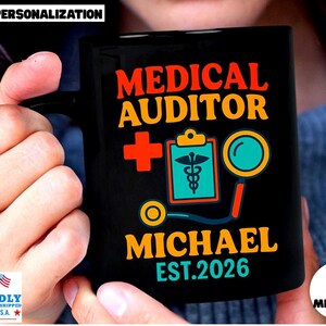 May include: A black ceramic mug featuring the text MEDICAL AUDITOR in orange and yellow, a red medical cross, a clipboard with a caduceus symbol, a magnifying glass, and the name MICHAEL with the text EST. 2026 in teal and orange colors.