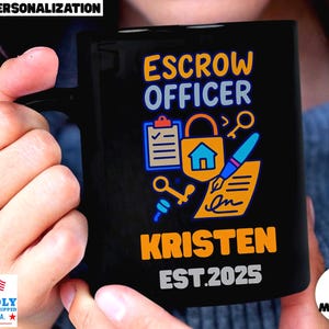 May include: Black ceramic mug with the words "ESCROW OFFICER" in blue and yellow. The mug features a lock, house, keys, and pen graphic. The name "KRISTEN" and the year "EST.2025" are printed in orange and white.