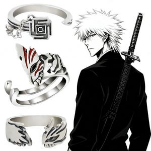 Puede incluir: Anillos plateados con diseños intrincados, incluyendo un patrón geométrico con una cadena y una máscara de zorro estilizada. Un personaje de anime en blanco y negro con una espada en el fondo.