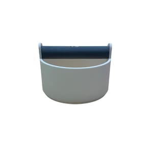 May include: A white plastic coffee pod holder with a black handle. The holder is designed to hold coffee pods and has a rounded shape.
