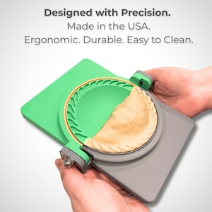 May include: A green and grey empanada maker with a crimped edge, holding a partially filled pastry. The text on the image reads: Designed with Precision. Made in the USA. Ergonomic. Durable. Easy to Clean.