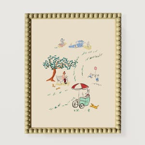 May include: A framed illustration of a whimsical scene with a green tree, a person sitting on a bench, a rabbit at an ice cream stand, and other figures. The illustration is in a light beige frame with a beaded border.