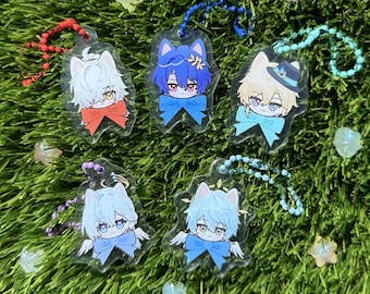 May include: Five colorful anime character keychains with different colored hair and outfits. Each keychain has a clear background and a silver chain.