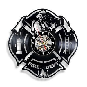 May include: Black wall clock in the shape of a firefighter's Maltese cross. The clock features a firefighter silhouette, a fire hydrant, and the words "FIRE DEPT". The clock hands are red.