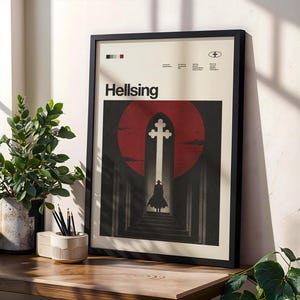 May include: A framed Hellsing poster featuring a silhouette of a figure in a long coat standing before a large arched doorway with a cross, set against a dark red circular background. The poster includes the text Hellsing and various small details.