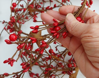 Bright Red Mixed Berry Strands with Rusty Tin Stars, 46" in length.