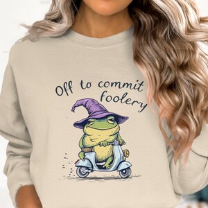Off to commit foolery frog wizard on scooter funny t-shirt cool frog witch hoodie quirky sweatshirt unique frog fashion