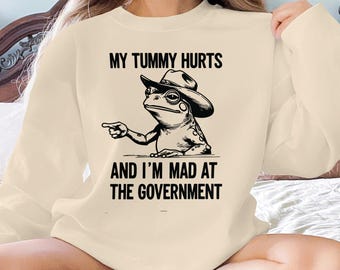 Lustiges Frosch-Grafik-T-Shirt: Mein Bauch tut weh, politischer Humor