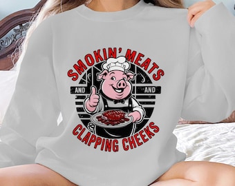 Funny BBQ Pig T-Shirt: Smokin' Meats Clapping Cheeks