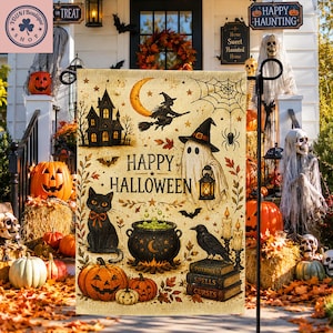 May include: A rectangular garden flag with a beige burlap texture featuring a black cat, a ghost holding a lantern, a cauldron, a raven, and a stack of books. The text reads Happy Halloween, accompanied by a crescent moon, spiderweb, and pumpkins.
