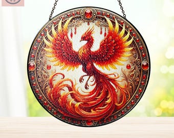 May include: A round stained glass window hanging with a chain. The window features a red and orange phoenix with a gold background and red jewels around the border.
