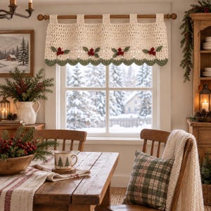 May include: A cream-colored crochet valance curtain hanging on a wooden rod, featuring a scalloped bottom edge in sage green and four decorative clusters of red holly berries with green leaves stitched across the center of the fabric.