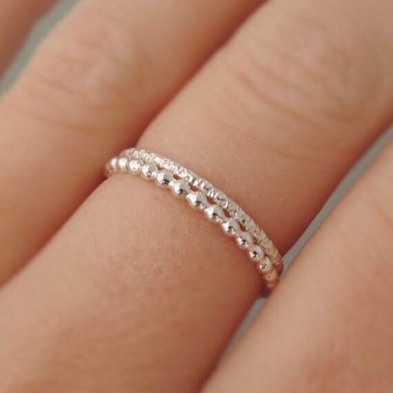 thin silver ring with tiny diamond