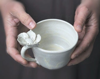 Stoneware cup with an anemone flower -  Stoneware Teacup  in cream