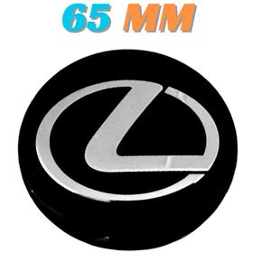 May include: A black car emblem with a silver Lexus logo in the center. The emblem is circular and has the text "65 MM" in blue and orange above it. The logo is a stylized "L" inside an oval.