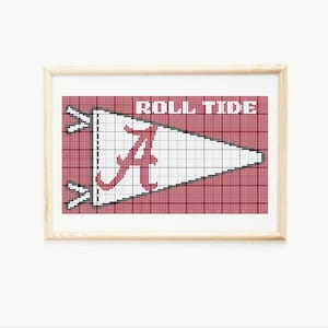 May include: A framed cross-stitch design featuring a white pennant with a red "A" and the words "Roll Tide" in red. The pennant is on a red and white checkered background.