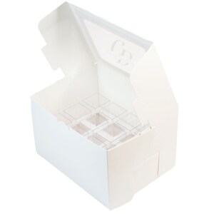 May include: White cardboard box with a clear plastic insert for holding small items. The box has a hinged lid and is open to reveal the insert. The insert has 12 compartments.
