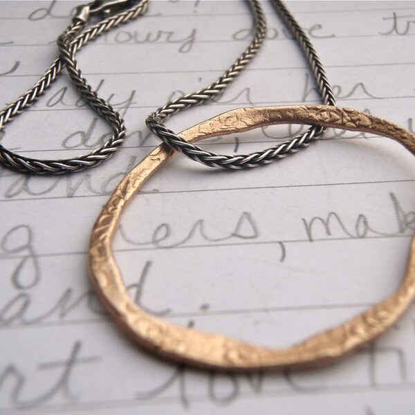 eternity necklace .  artisan recycled bronze circle pendant . woven sterling chain