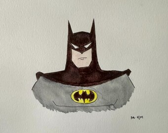 Op de afbeelding: Een aquarel schilderij van Batman's hoofd en schouders. Hij draagt zijn iconische zwart-grijze kostuum met het gele vleermuis symbool op zijn borst. Het schilderij heeft een eenvoudige, cartoonachtige stijl.