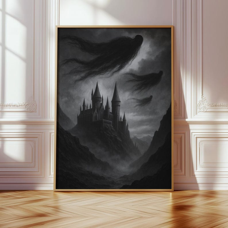May include: A framed grayscale print showing a gothic castle on a mountain, with dark, flowing figures in the sky. The artwork is set against a moody, cloudy backdrop, creating a dramatic and mysterious scene. The frame is a warm gold colour.
