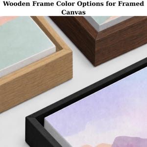 May include: Close-up of three framed canvas art pieces with different wooden frame color options: natural, dark brown, and black. The text at the top reads "Wooden Frame Color Options for Framed Canvas."