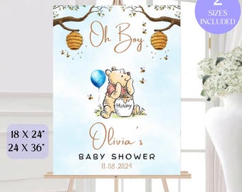 Può includere: Un cartello per baby shower a tema Winnie the Pooh con sfondo blu, un cartone animato di Winnie the Pooh che tiene un barattolo di miele, un palloncino blu e il testo "Oh Boy" e "Baby Shower di Olivia 11-08-2024".