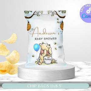 May include: A custom chip bag for a baby shower, featuring a Winnie the Pooh design. The bag has a light blue background with a cartoon illustration of Pooh Bear holding a balloon. The text "Anderson's Baby Shower" is displayed in gold script. The bag measures 11x8.5 inches.
