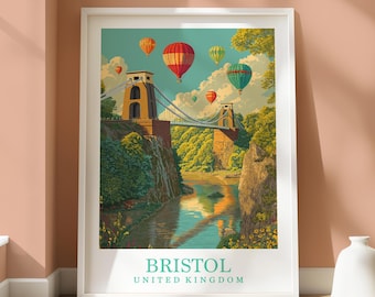May include: Framed art print featuring the Clifton Suspension Bridge in Bristol, United Kingdom. The artwork depicts the bridge over a river, with colorful hot air balloons in the sky. The print has a white border and the text "BRISTOL UNITED KINGDOM".