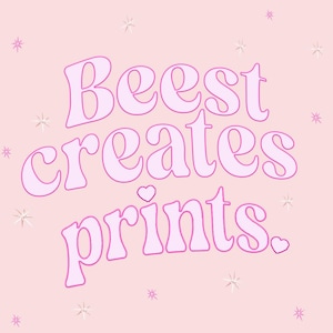 May include: Pink graphic with the text "Beest creates prints." in a stylized font. The text is outlined in a darker pink and there are small pink hearts scattered around the text.