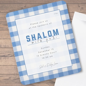 May include: A blue and white checkered invitation card with the text "Please join us at the Upsherin of SHALOM pn3. pire" and details for the event: Sunday, December 15, 15 Simcha Court, 10:30 am. The card is signed "Shah & Dubby Lanen".