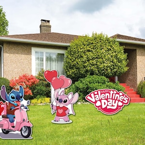 May include: Valentine's Day garden decorations with cartoon characters. One character rides a pink scooter, another holds heart-shaped balloons, and a third holds a heart. A sign says "Happy Valentine's Day".