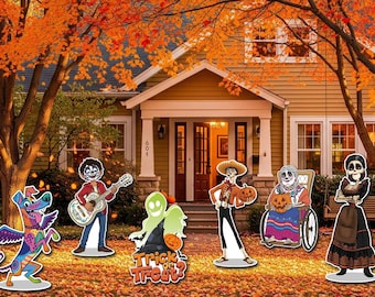 May include: Halloween yard decorations featuring characters from the movie Coco, including a guitar-playing boy, a dog, a ghost, and other figures. The decorations are set in a yard with fall foliage and a house in the background.