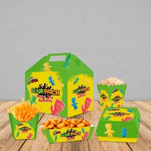 May include: A set of green and yellow party favor boxes with a Sour Patch Kids theme. The boxes feature a cartoon character and the text "Sour Patch Kids" and "Mateo's 2nd Birthday".