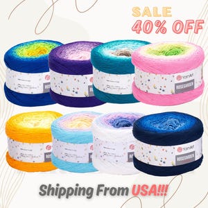 May include: Eight skeins of ombre yarn in various colors, including yellow, blue, pink, purple, and teal. The yarn is labeled "YarnArt RoseGarden".
