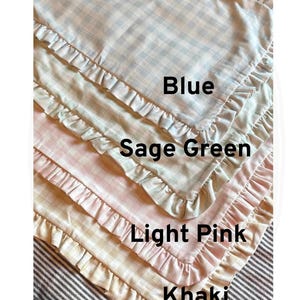 May include: Four fabric items with a gingham pattern and a ruffled edge, in blue, sage green, light pink, and khaki. Each item is labelled with its colour name in black text.