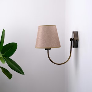 Aged Brass Finish and Wicker Lampshade