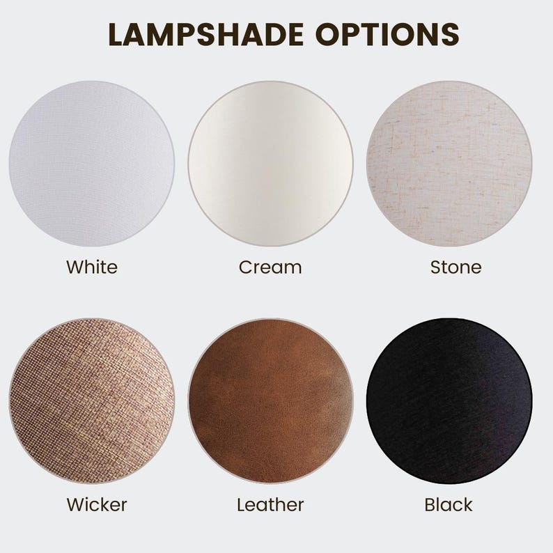 May include: Image showcasing six lampshade options. The options include white, cream, stone, wicker, leather, and black. The text "LAMPSHADE OPTIONS" is at the top of the image. Each lampshade option is a circle.