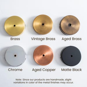 May include: A collection of six round metal ceiling canopy options. Finishes include brass, vintage brass, aged brass, chrome, aged copper, and matte black. The text in the image states that slight variations in color may occur.
