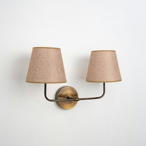 Aged Brass Finish and Wicker Lampshade Sconce