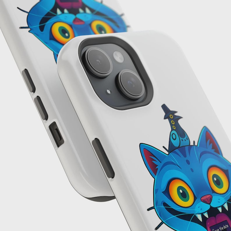 May include: White phone case featuring a blue cartoon cat with large yellow eyes, a crown, and a tongue sticking out. The cat design is repeated on a second case in the background. The text "Save the date" is visible on the cat's tongue.