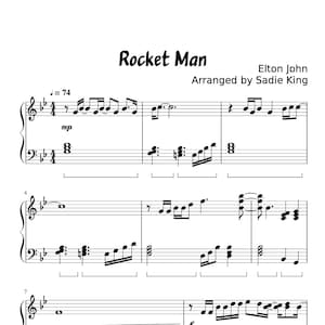 Op de afbeelding: Partituur voor het lied "Rocket Man" van Elton John, gearrangeerd door Sadie King. De muziek is geschreven in standaardnotatie met een maatsoort van 4/4 en een tempo van 74 slagen per minuut. De toonsoort is C-majeur. De muziek bevat een pianopartij en een zangpartij.