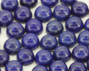 May include: A collection of round, blue lapis lazuli cabochons. The cabochons are smooth and polished, with a deep blue color and a slight sparkle.
