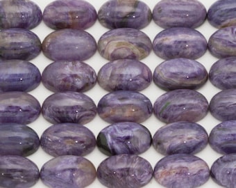 May include: Twenty-five oval-shaped purple and white stones with a marbled pattern.
