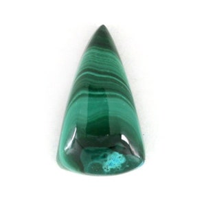May include: A green malachite cabochon gemstone with a pointed shape and a smooth, polished surface.